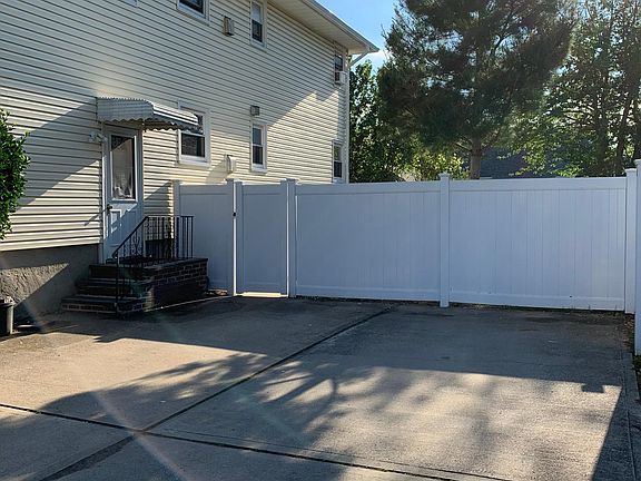 Double-laned driveway fits 4 vehicles (2+2); extra fee per lane. Free street parking also available.