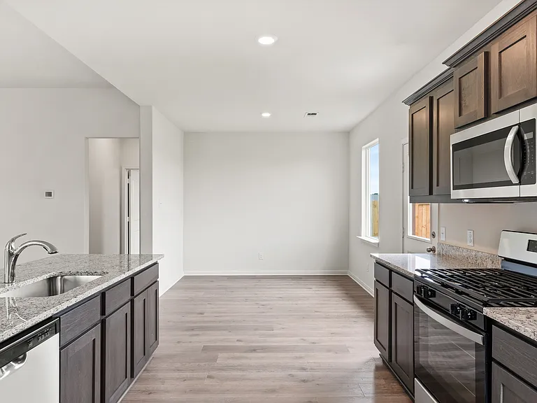 The dining room of sits right off of the kitchen.