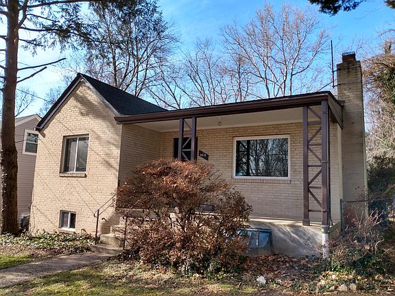 Front View with azaleas and front porch for weekend reading.