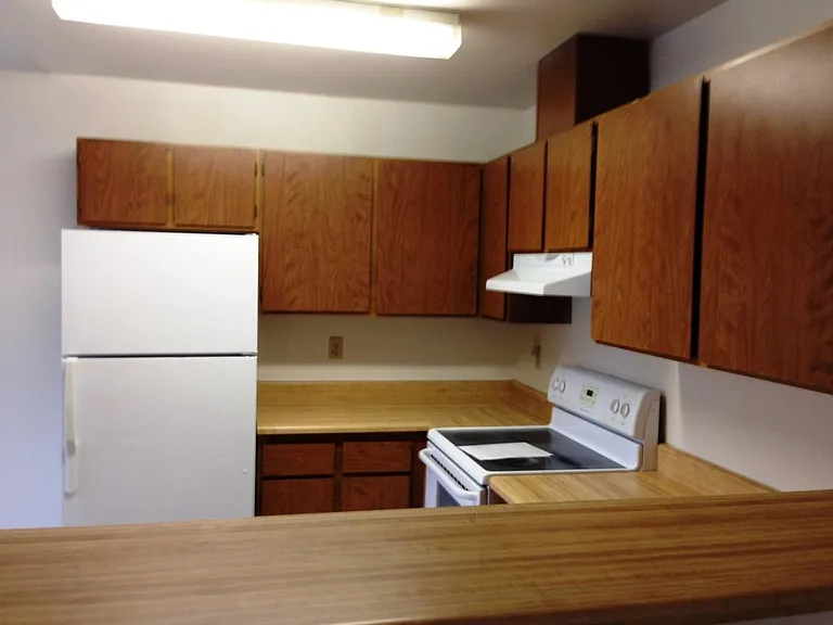 Kitchen with refrigerator and stove