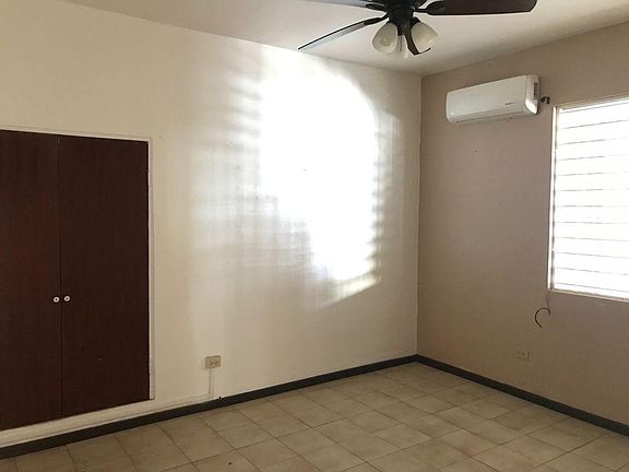 One of the three bedrooms equipped with ceiling fan and a/c.