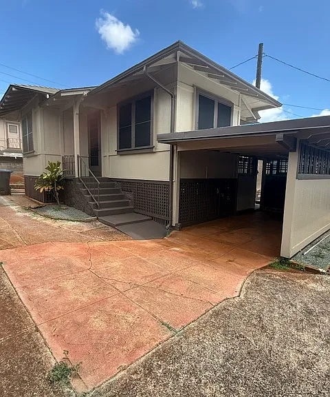 Front of house with attached carport