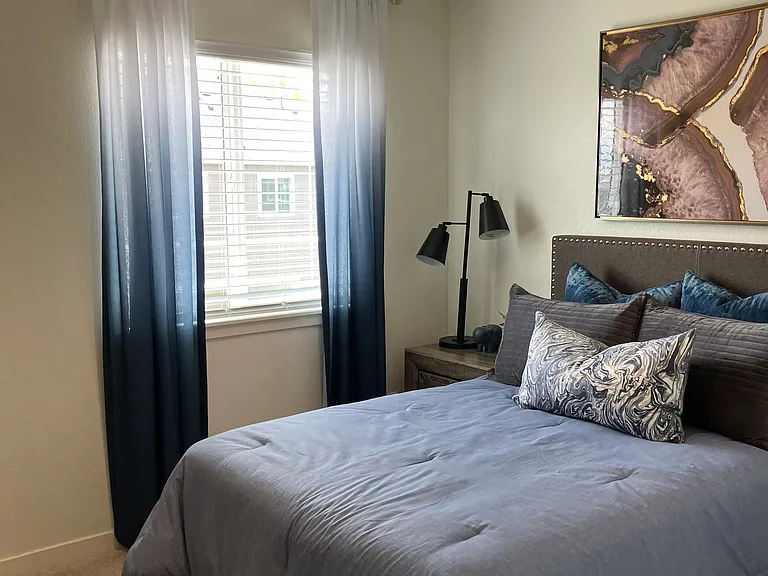 Sample of same floor plan, different finishes, staged with furniture.