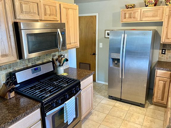 Kitchen with included appliances