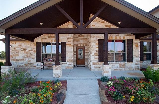 What an amazing look for this home. Just waiting to greet you with its newly stained beams.
