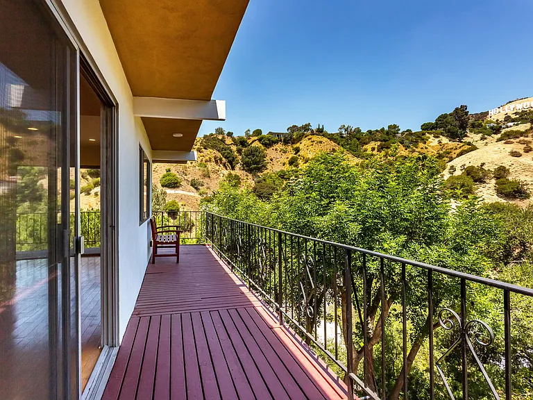 Huge deck extending from living and dining room. Hollywood sign in the sunshine.