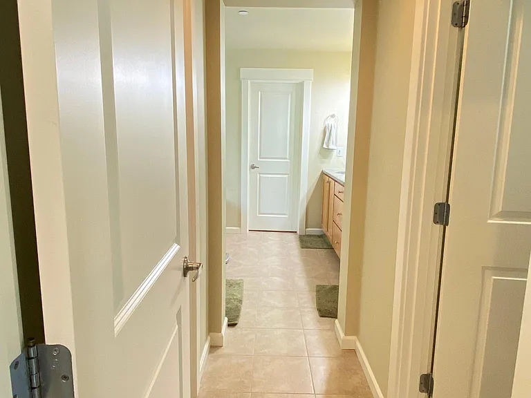 Entrance to the Master bathroom with two walk-in closets (no more wardrobe takeovers ;)) , two vanity, tub & a shower area and a privacy door to the toilet.