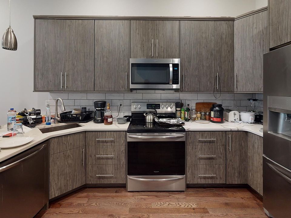 Expansive kitchen with stainless steel appliances