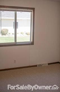 Court yard view bedroom
						:
						Bedroom with two closets - neutral beige