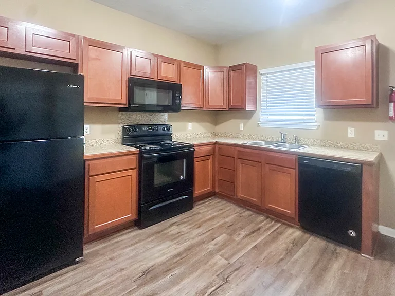 Kitche, stove, oven, microwave, diswasher and refrigerator - 507 E Lagarange St, Lake Charles La - Listed by Homes for Rent in Lake Charles LA
