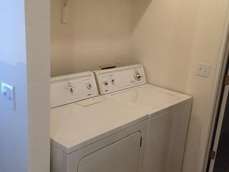 Washer drier included in laundry room off of kitchen