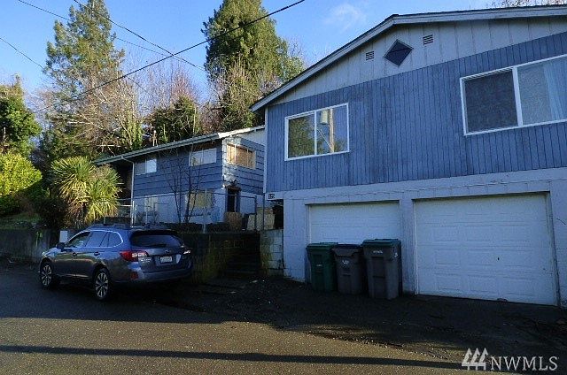 Front view of Duplex with unit above 2 car garage Upper unit on duplex is 3 bedroom 1 bath Lower unit is 1 bedroom 1 bath Unit above garage is 2 bedroom 1 bath