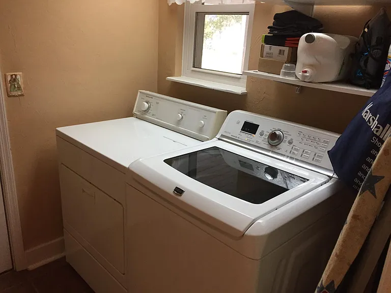 Indoor Laundry Room with Washer and Dryer. Clothes washer brand new.
