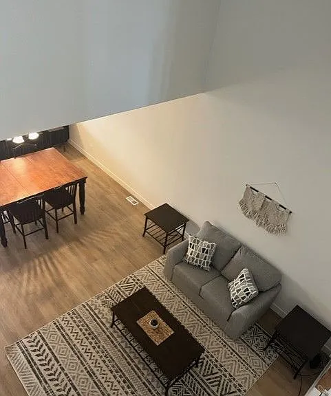 Upstairs open space view of living room.
