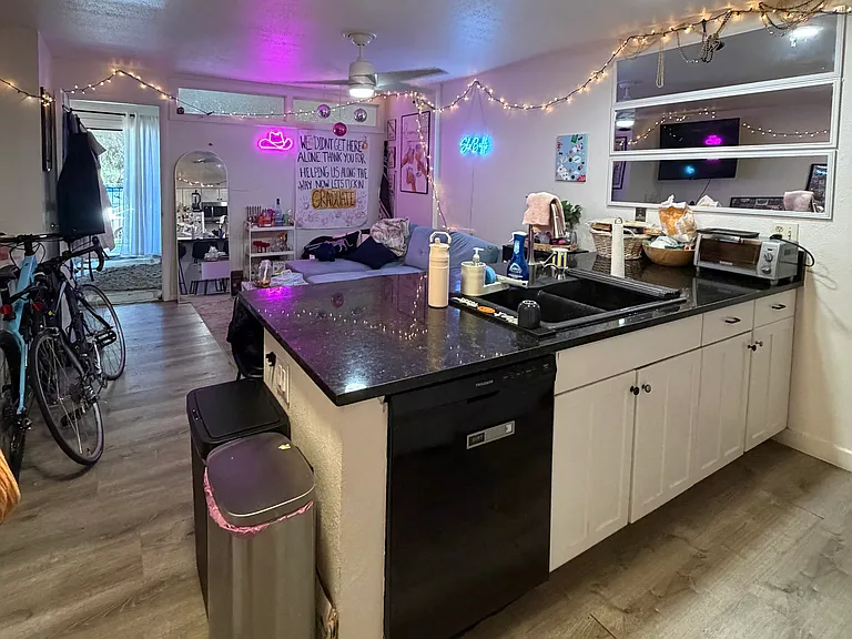 Kitchen, living room, upstairs bedroom with balcony