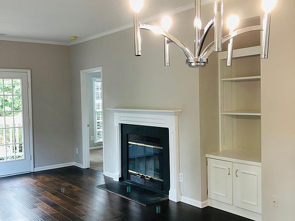 Fireplace and built in shelves in living room