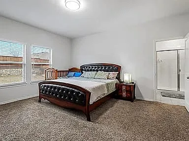 Master bedroom with His and Her separate closets