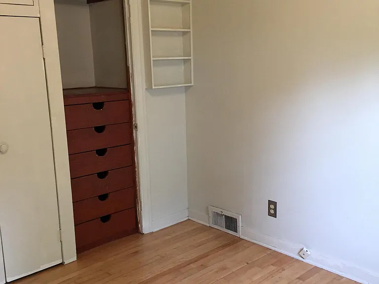 Bedroom #2 with Built-in cabinets. Old photo, fresh paint shown in furnished photos.