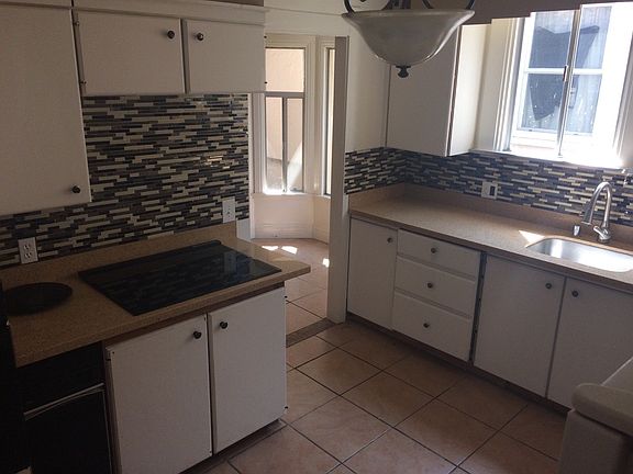 The kitchen is adjacent to a dining/kitchen nook.