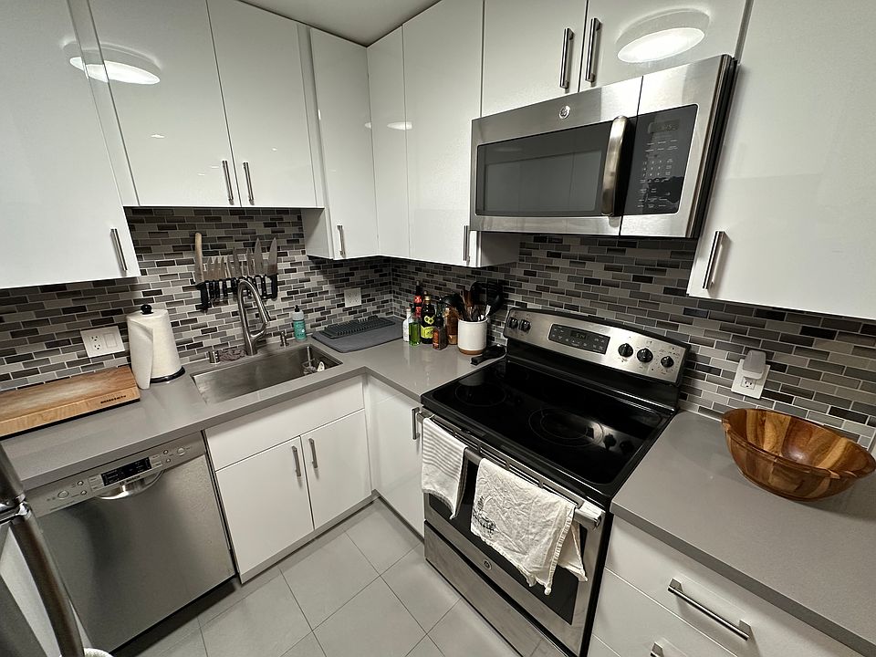 Modern kitchen with stainless steel appliances and dishwasher