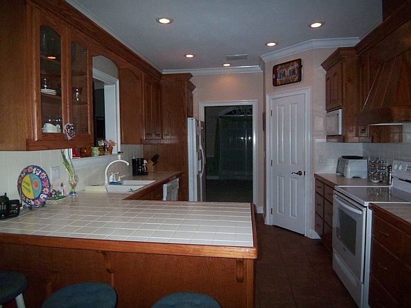breakfast bar, custom cabinets, huge corner pantry