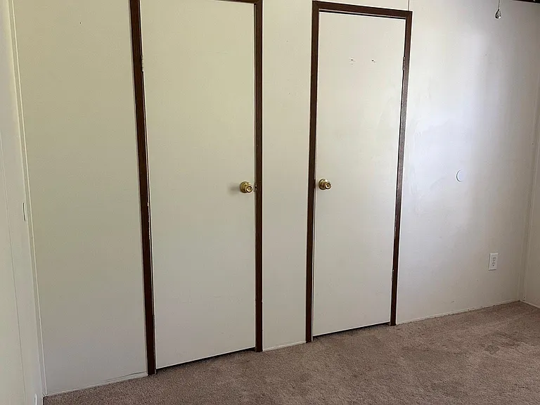 Second bedroom displaying Closet doors.