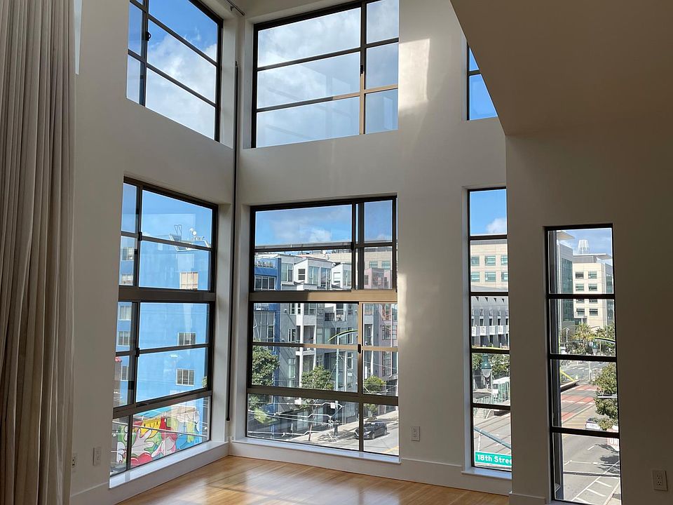 Light filled living room with high ceilings and skylight.