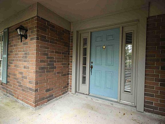 A generous porch welcomes you inside.