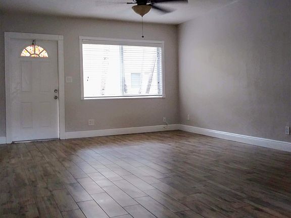 Light-filled great room with porcelain wood planking.