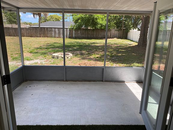 Screen porch view of the big backyard.