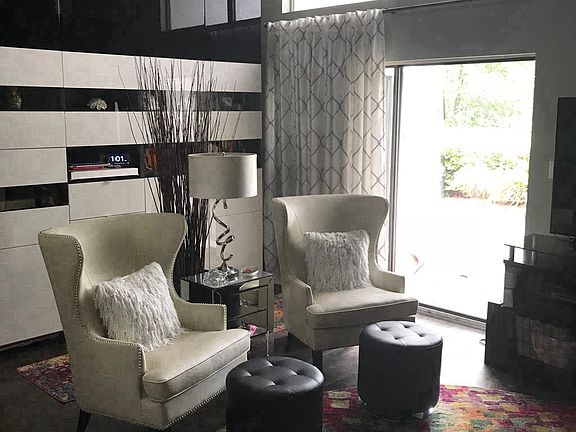 Large living area with access to covered outdoor patio