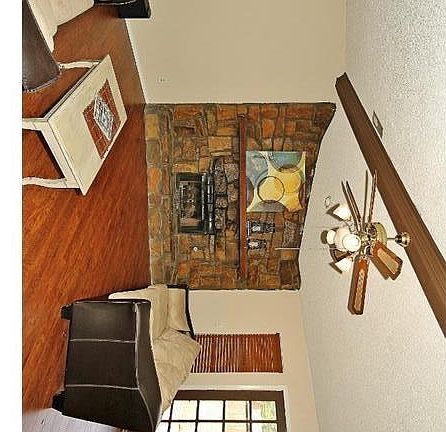 Living Room has laminate wood flooring and new door to backyard.