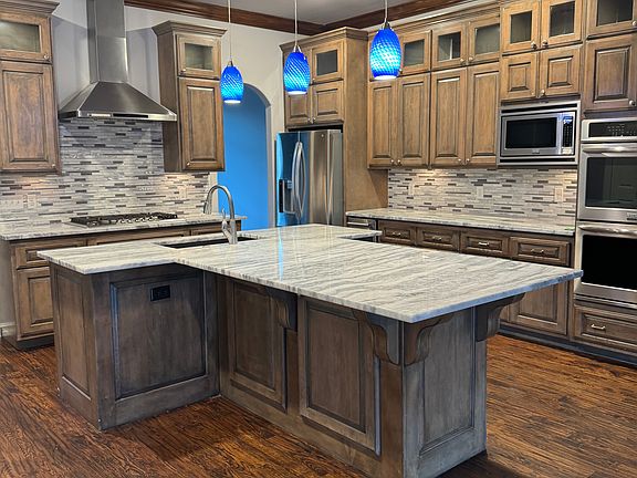 Granite countertops and glass backsplash