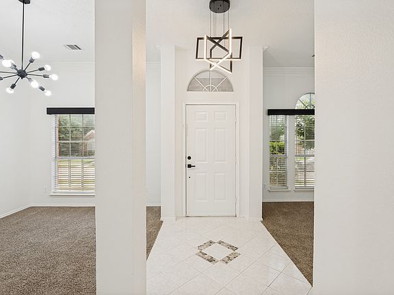 Entry hall with living & dining rooms to each side.