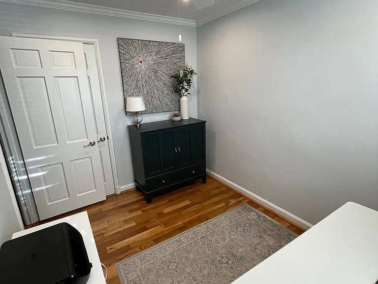 Bedroom/office with standalone closet.