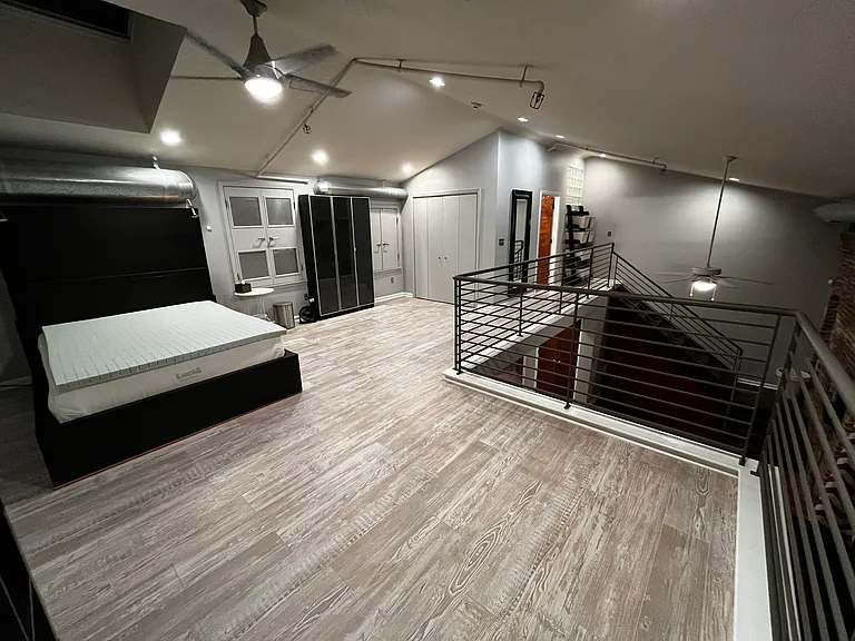 Upstairs bedroom area (remote opening skylight above bed in photo)