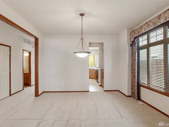 The dining room can accommodate a large table for easy entertaining, and a convenient butler's pantry leads into the kitchen.