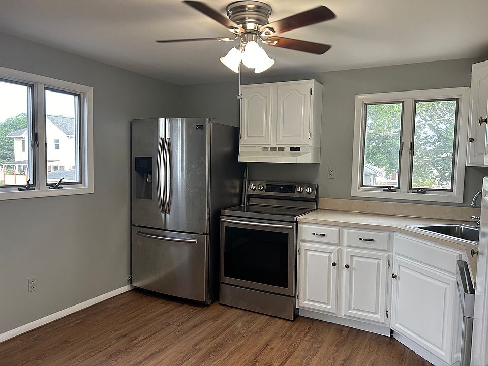 Country Kitchen with Stainless appliances.
