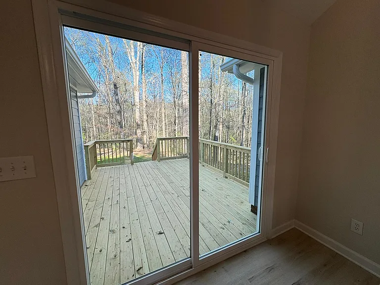 Second sliding door from dining to back deck area.