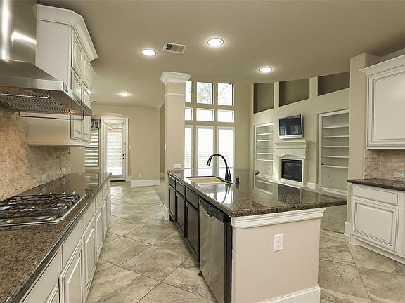 Massive island kitchen/breakfast bar that opens to the family room!
