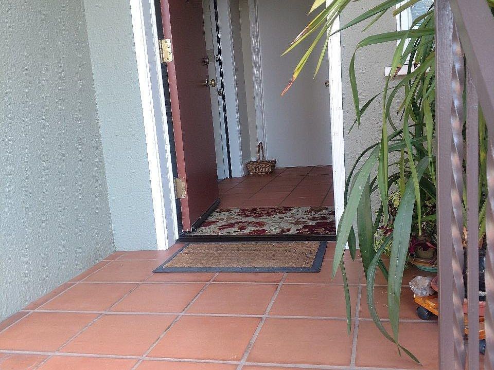 Side entrance to unit, with entry door on left. Owner's entrance is on right wall.