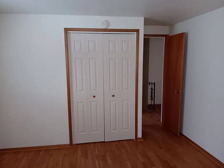 Good size second bed room upstairs with closet and smoke detector (fresh paint)