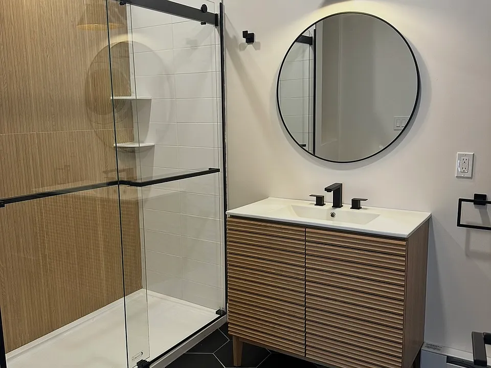 Previous work done by the same developer. Quartz countertops, full size stainless steel appliances. In-unit laundry, mini splits. Final product to be the same quality.