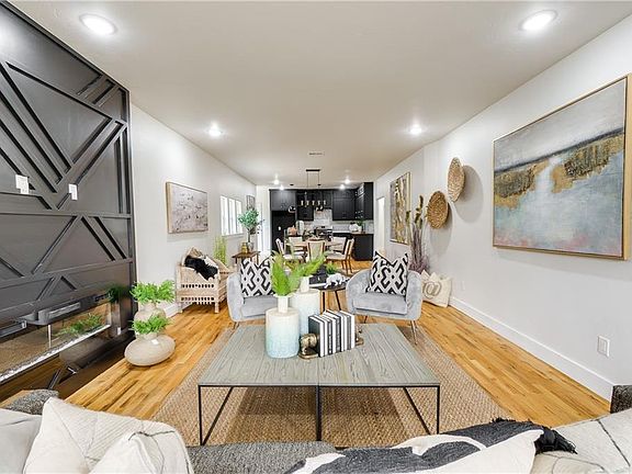 Open floor plan with living room, dining room, and kitchen.