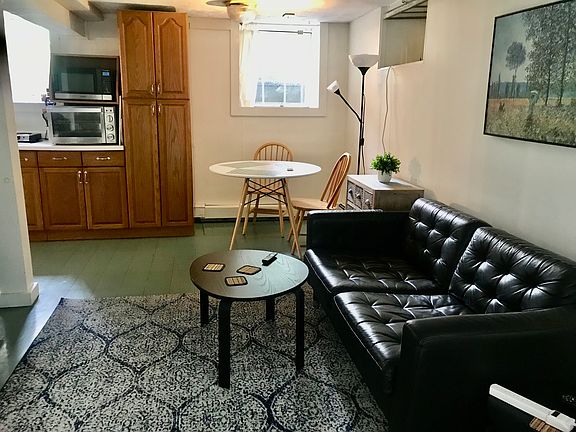 The living room, eating area and kitchen form an L shaped area.