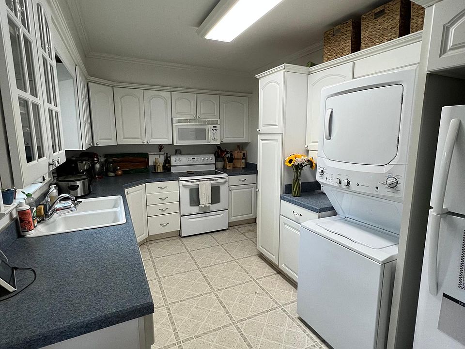 Stackable laundry unit in kitchen