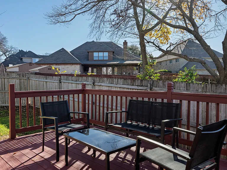 Spacious deck in the backyard with outdoor seating for family and friends!