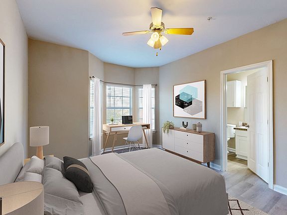 Spacious bedroom with large bay window and en-suite bathroom