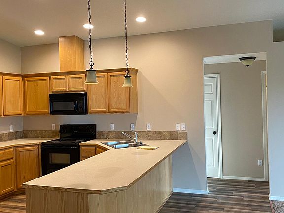 Kitchen and hallway to bathroom and bedrooms