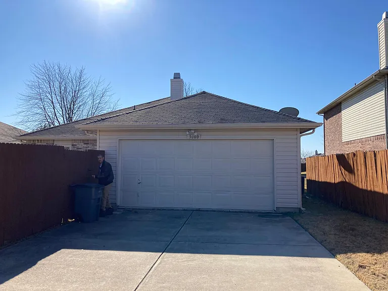 Double car garage off alley behind house.